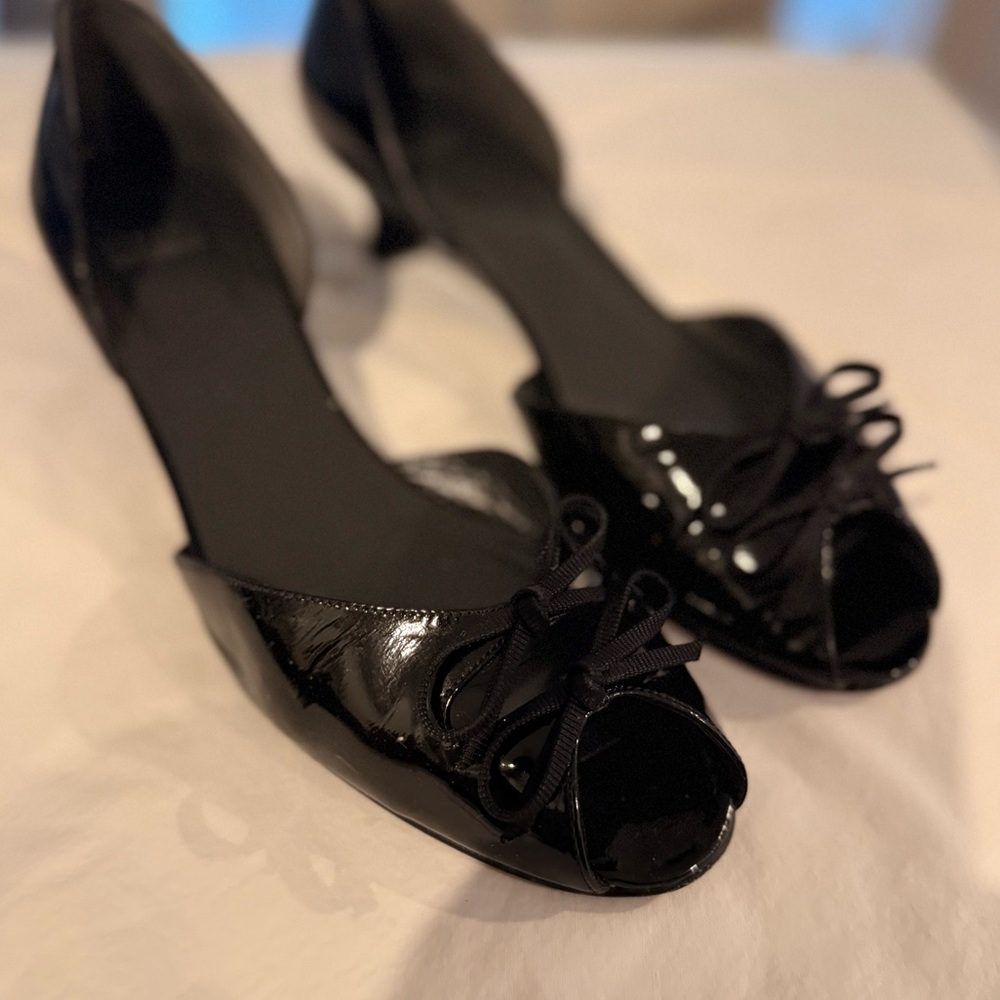 Stuart Weitzman black patent open toe kitten heels.